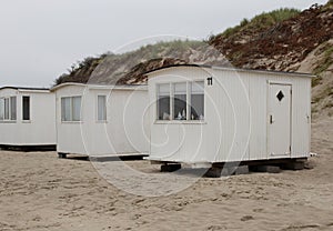 The beautiful white beach cabins at Blokhus Beach in Denmark