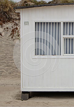 The beautiful white beach cabins at Blokhus Beach in Denmark