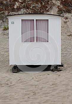 The beautiful white beach cabins at Blokhus Beach in Denmark