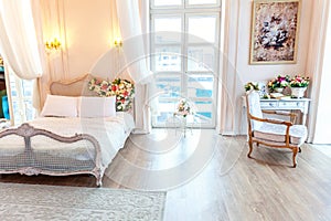 Beautiful white bright clean interior bedroom in luxurious baroque style