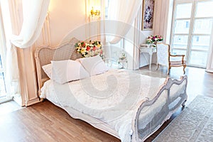 Beautiful white bright clean interior bedroom in luxurious baroque style