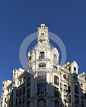 Beautiful white building facade with a tower, Gran Via, Madrid, Spain photo