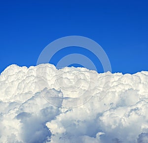 Beautiful white clouds beneath blue sky background