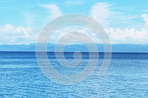 Beautiful white clouds on blue sky over calm sea with sunlight reflection, Sunny sky and calm blue ocean