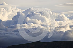 Beautiful white clouds on sky at dawn. Sunrise, stormy cloud. Cumulus clouds