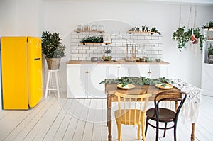 beautiful white cosy modern kitchen interior,kitchenware, home style, with yellow fridge