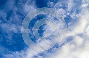 Beautiful white fluffy cloud formations in a deep blue summe sky