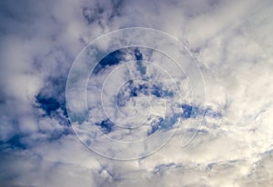 Beautiful white fluffy cloud formations in a deep blue summe sky