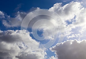 Beautiful white fluffy clouds in a blue sky on a sunny summer day