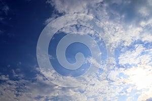 Beautiful white fluffy clouds on a deep blue sky in high resolution