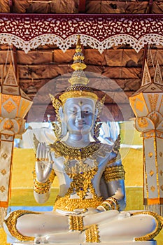 Beautiful white gold Buddha image statue at the public Thai Buddhist temple in Chiang Mai, Thailand