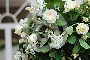 Beautiful White and Green Flower Decoration Arrangement on Wedding Table Golden Support . Wedding Bridal Flower Decoration. photo