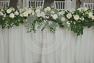 Beautiful White and Green Flower Decoration Arrangement on Wedding Table. Wedding Bridal Flower Decoration.