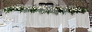 Beautiful White and Green Flower Decoration Arrangement on Wedding Table. Wedding Bridal Flower Decoration. Banner.