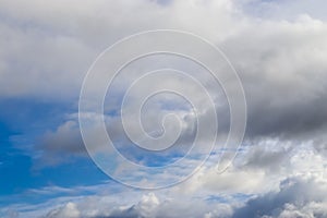 Beautiful white and grey clouds and cloud formations on a deep blue sky