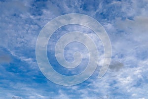 Beautiful white and grey clouds and cloud formations on a deep blue sky