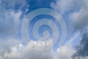 Beautiful white and grey clouds and cloud formations on a deep blue sky