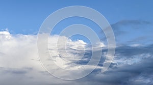 Beautiful white and grey clouds and cloud formations on a deep blue sky