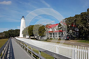 Beautiful white lighthouse, old oaks and a blue blue sky on the NC Island of Ocracoke
