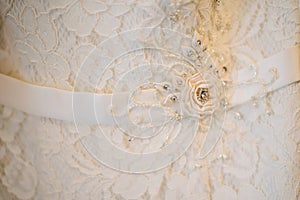 Beautiful white ornament on a bridal wedding dress