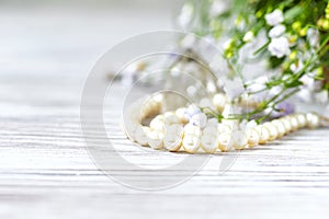 Beautiful white pearl necklace with white flowers