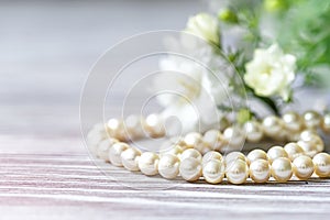 Beautiful white pearl necklace with white flowers