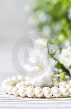 Beautiful white pearl necklace with white flowers