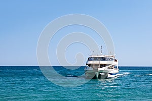 Beautiful white pleasure yacht at sea. Tourist ship in the ocean.