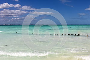 Beautiful white sand beach in the caribbean sea with beautiful turquoise colors under a blue sky. Caribbean beaches of golden sand