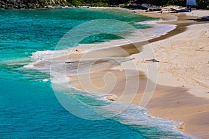 Beautiful white sandy beach surrounded by turquoise water in Trunk Bay on the island of St. John