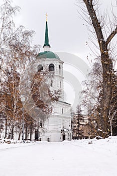 Beautiful white snowy path in the cold and winter leading to a church.