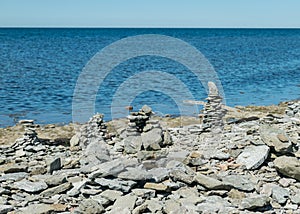 Beautiful white stone piles by the sea, these objects were built by travelers, Saaremaa Island, Estonia