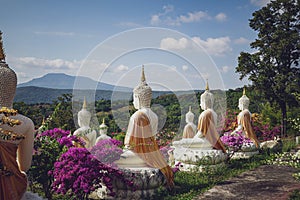 beautiful white stucco Buddha statue enshrined on the hillside It is a place of meditation called Wat Sutesuan.