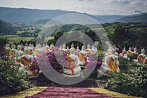 beautiful white stucco Buddha statue enshrined on the hillside It is a place of meditation called Wat Sutesuan.