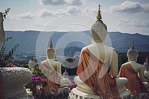 beautiful white stucco Buddha statue enshrined on the hillside It is a place of meditation called Wat Sutesuan.