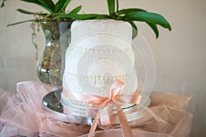 Beautiful white wedding cake with decoration detail