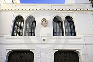 Beautiful whitewashed facade of Guzman Palace in Sanlucar de Barrameda town