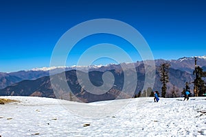 A beautiful wide angle shot focused on the dhauladhar mountain ranges captured from the base camp of kedarkantha mountain dec-2018