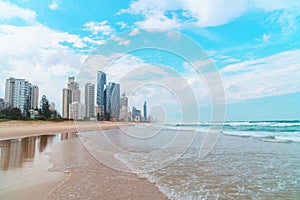 Beautiful wide panoramic view of the Gold Coast skyline and Surfers Paradise beach with rolling waves of Pacific ocean.