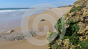 Beautiful, wide sandy beach on the Atlantic Ocean at low tide, Armacao de Pera, Silves, Algarve, Portugal