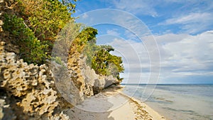 Beautiful wild tropical beach near Anda with granite rocks. Bohol Island. Philippines.