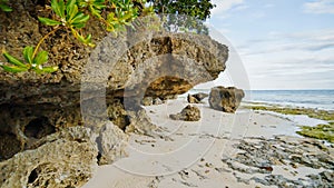 Beautiful wild tropical beach near Anda with granite rocks. Bohol Island. Philippines.