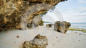Beautiful wild tropical beach near Anda with granite rocks. Bohol Island. Philippines.