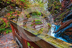 Beautiful Wimbachklamm gorge with wooden path in autumn colors, Ramsau bei Berchtesgaden