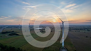 Beautiful wind turbine in the countryside in the time of sunset background. Wind Turbines Windmill Power Farm