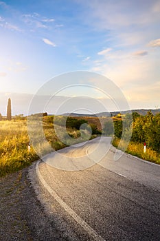 Beautiful winding country road leading through rural countryside