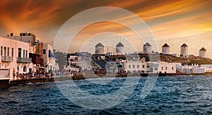 The windmills above Mykonos town during sunset time, Greece