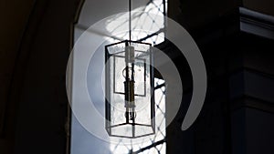 Beautiful window and a lamp in the german catholic church. Details, 16:9 panoramic format