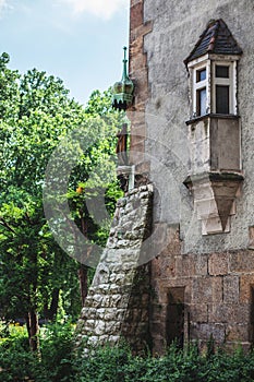 Beautiful window on the wall of an old building in the park