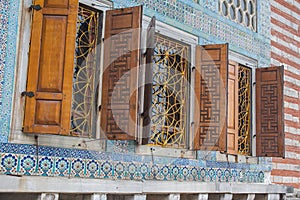 Beautiful windows with lattices and wooden shutters in Istanbul`s historic palace. Turkey photo